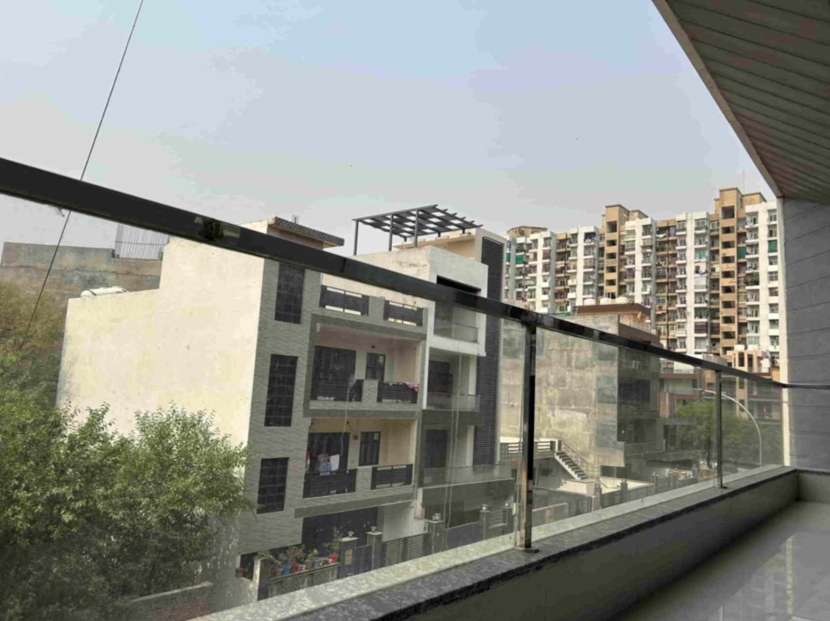 happy living coliving space room and balcony bedrooms sector 121